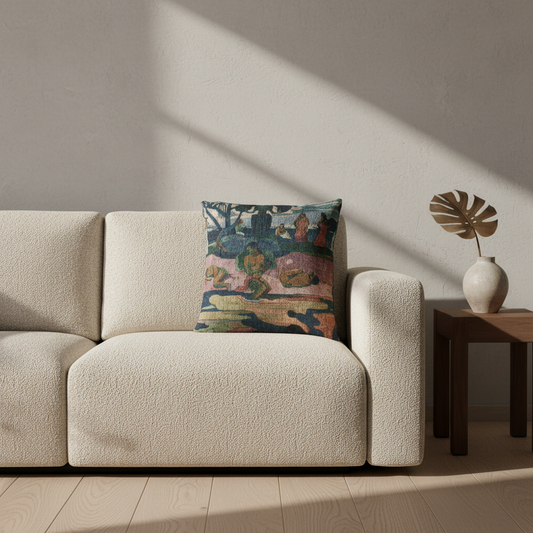 A square decorative throw pillow with a colorful, painterly landscape pattern sits on a cream boucle sofa in a modern living room setting with warm sunlight and shadows.