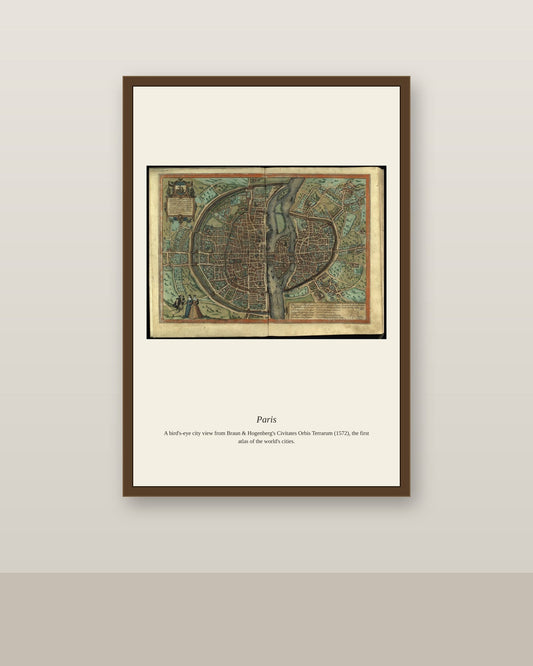 Paris antique city map print shown framed on a wall in a styled room
