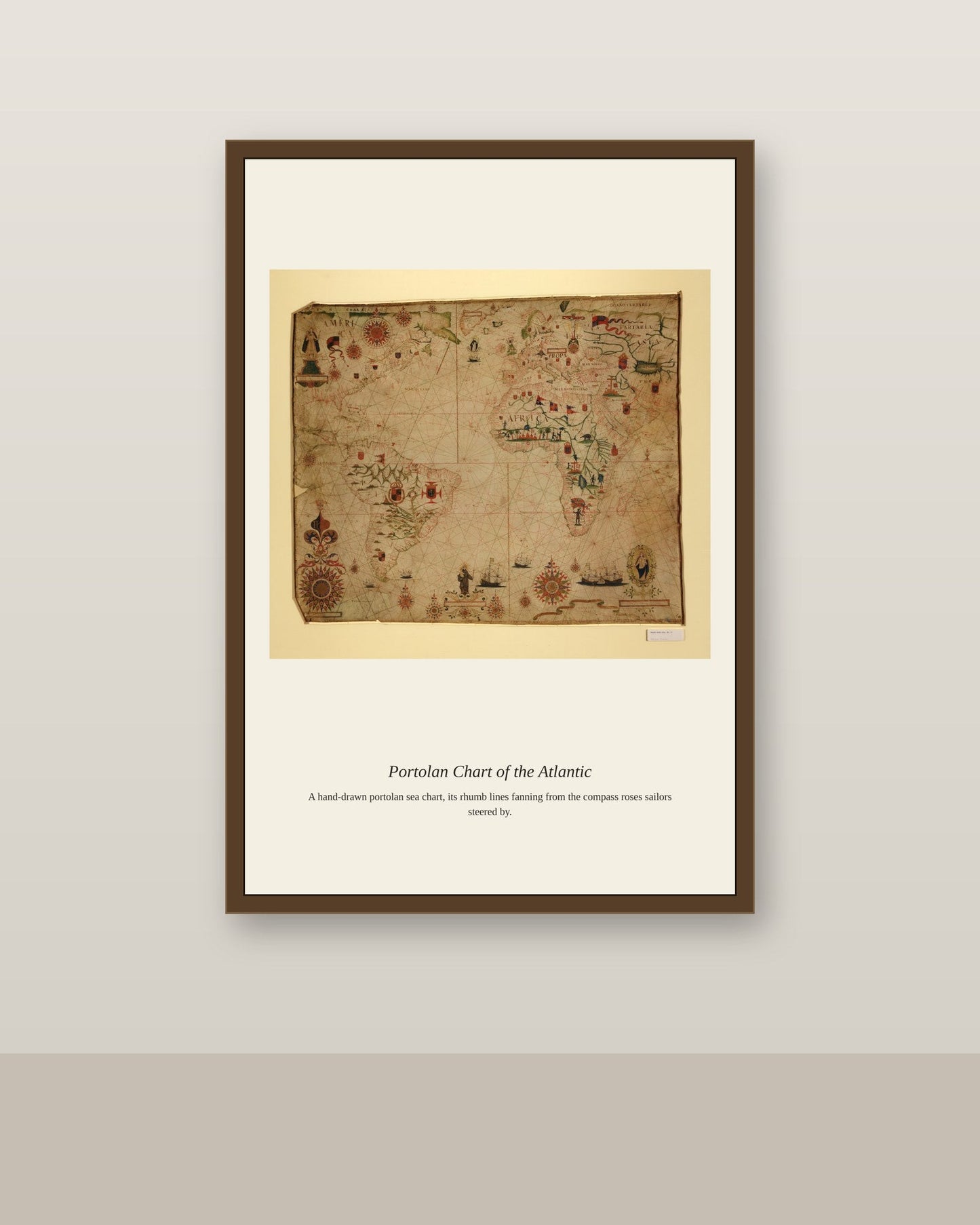 Portolan Chart of the Atlantic Ocean antique nautical chart print shown framed on a wall in a styled room