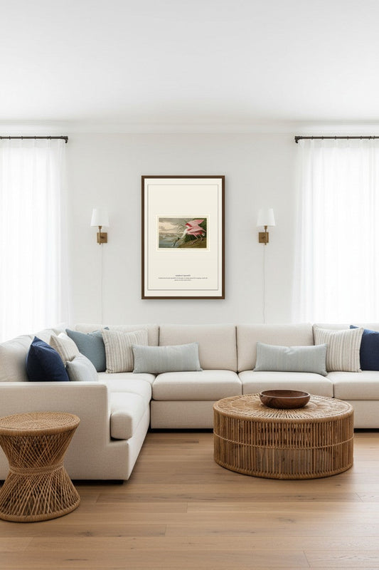 Audubon's Spoonbill print framed above a sectional sofa in a bright living room