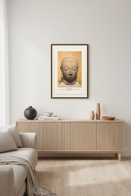 Buddha of Sarnath print above a light fluted wood sideboard in a living room