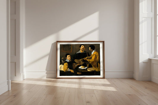 The Three Musicians — Diego Velázquez Fine Art Poster shown framed and leaning against a wall in a sunlit room