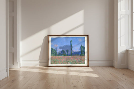 Poppy Field (Giverny) — Claude Monet Fine Art Poster shown framed and leaning against a wall in a sunlit room
