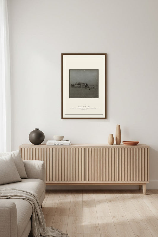 Fleeing the Dust Bowl print in a dark frame above a fluted wood sideboard and sofa