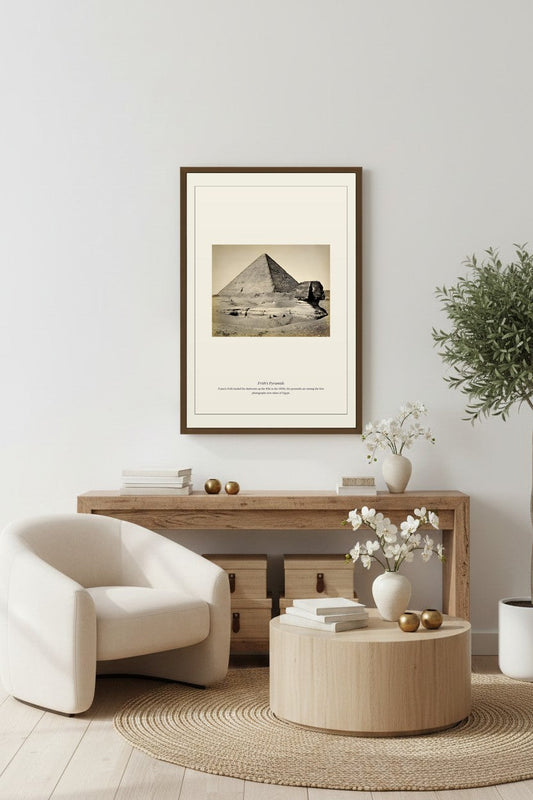 Pyramid and Sphinx photo print framed above a console with white armchair