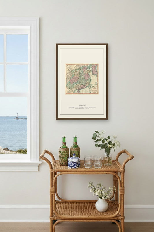 Framed The Great Wall map print above a beige sectional sofa in a living room