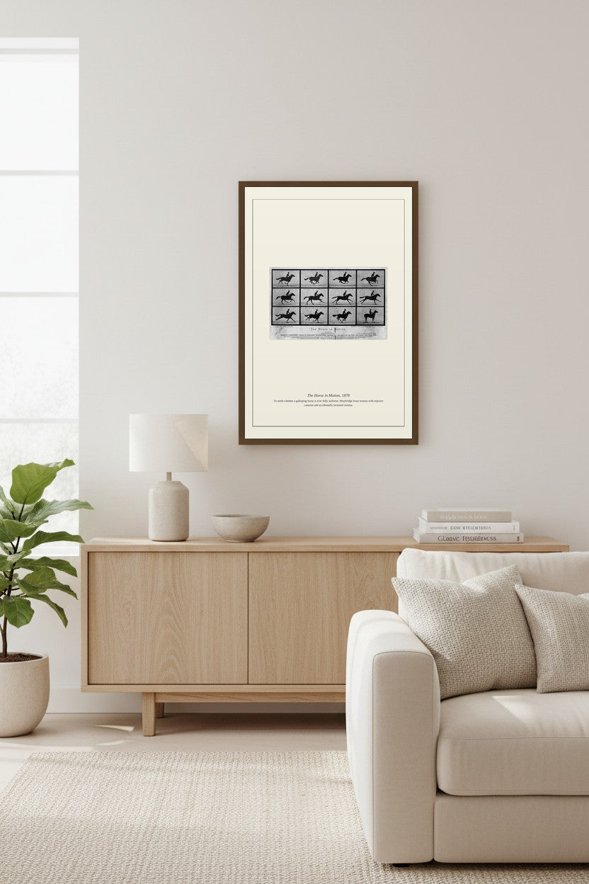 Framed Horse in Motion photography series above a white brick fireplace and sectional sofa