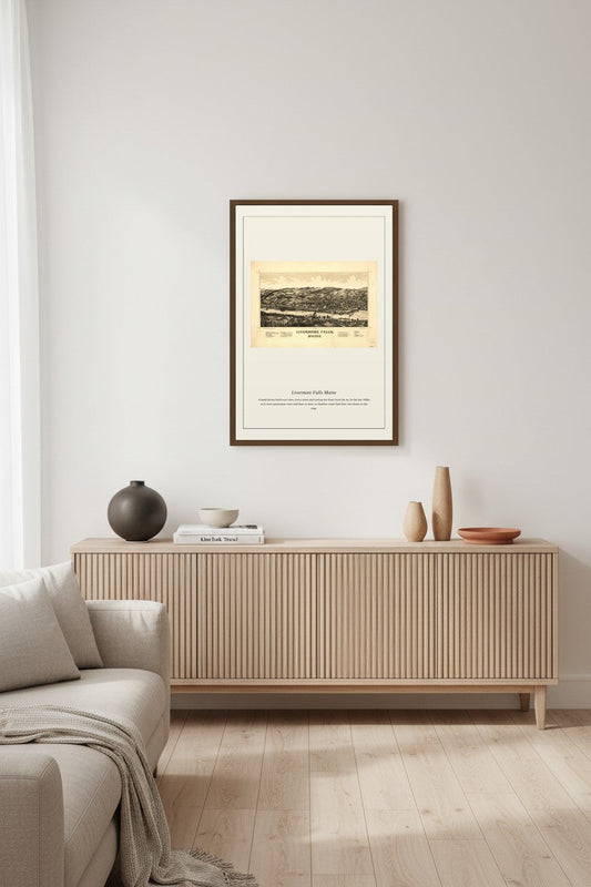 Livermore Falls Maine antique map framed above a light wood console table with ceramic vases