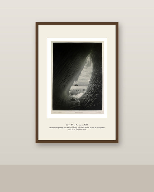 Framed Terra Nova Ice Cave print in a dark wood frame on a neutral wall