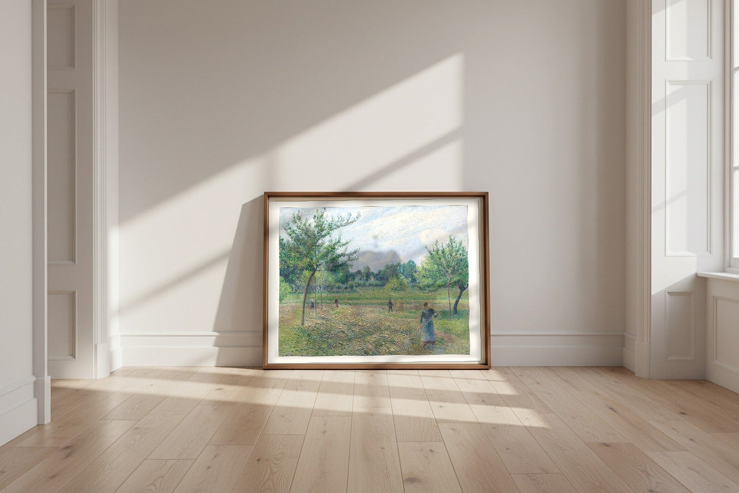 Haymaking at Éragny — Camille Pissarro Fine Art Poster shown framed and leaning against a wall in a sunlit room