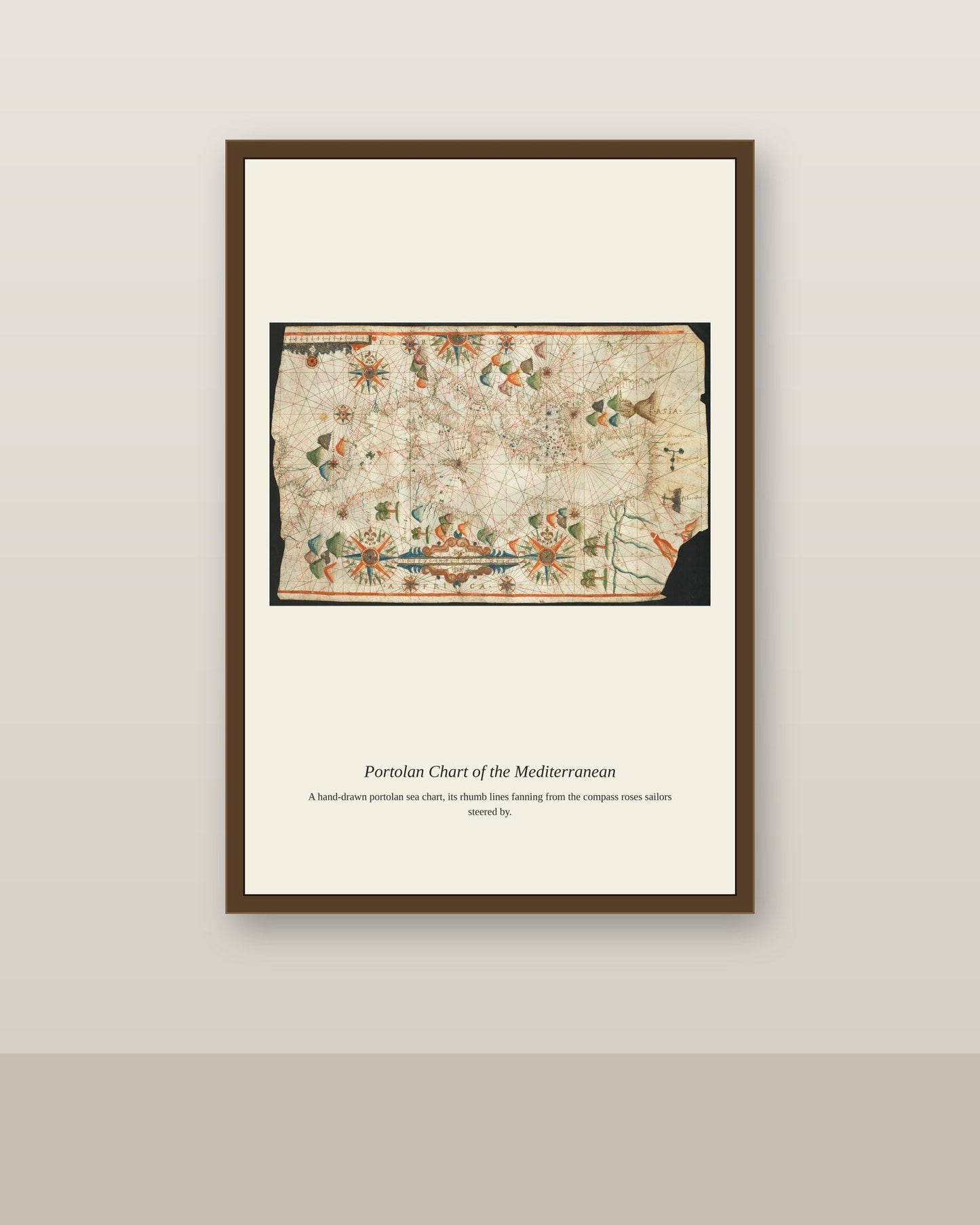 17th Portolan Chart antique nautical chart print shown framed on a wall in a styled room