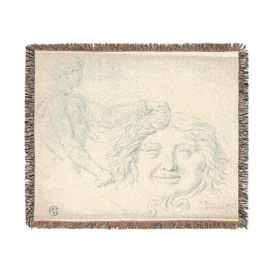 A rectangular woven throw blanket featuring a classical sketch of a face and draped figure in muted blue-gray tones on a warm cream background, finished with multicolor fringed edges.