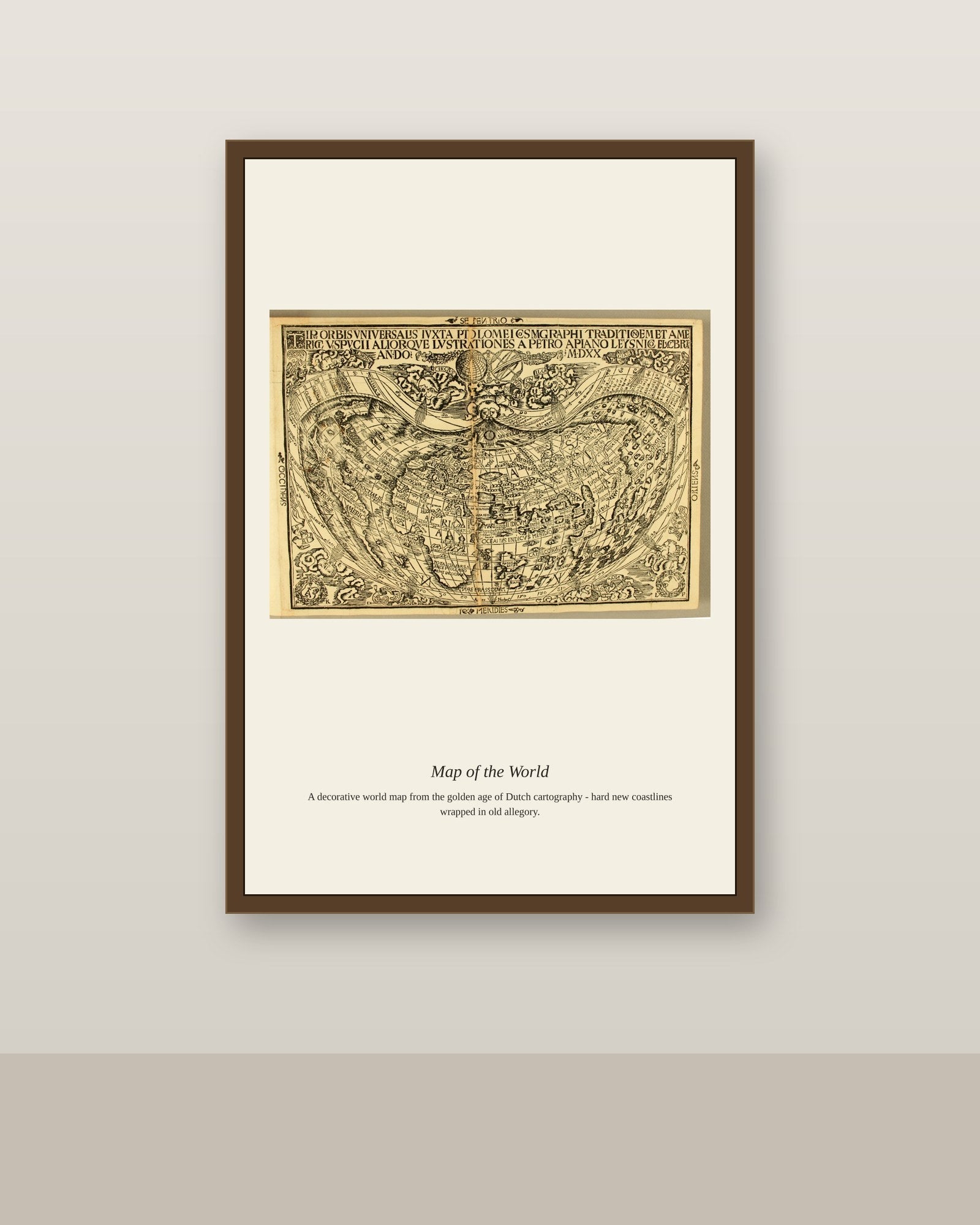 Apian World Map antique world map print shown framed on a wall in a styled room