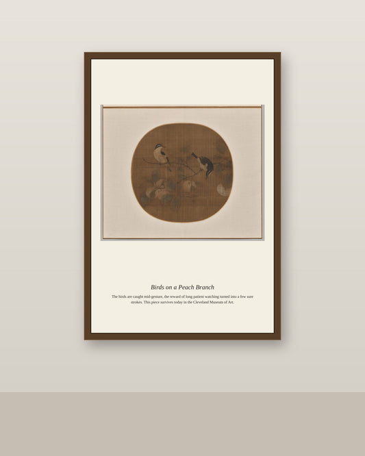 Birds on a Peach Branch antique natural history print shown framed on a wall in a styled room