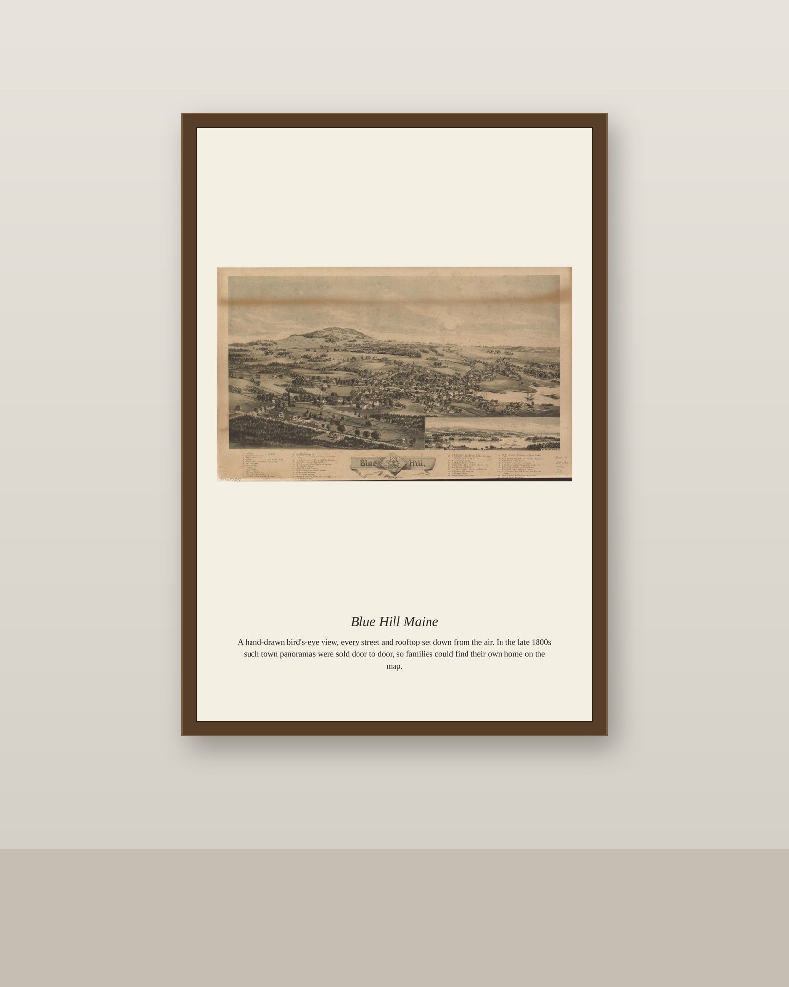 Blue Hill Maine antique map print shown framed on a wall in a styled room