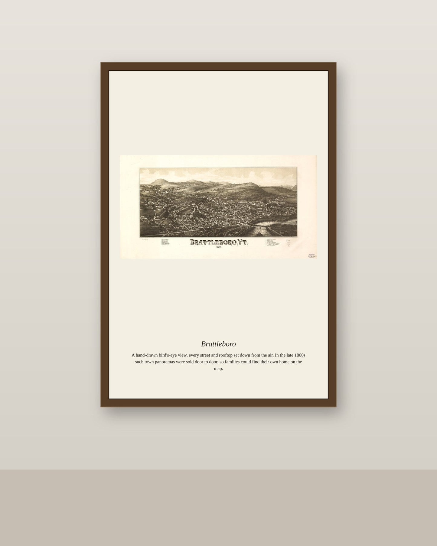 Brattleboro antique map print shown framed on a wall in a styled room