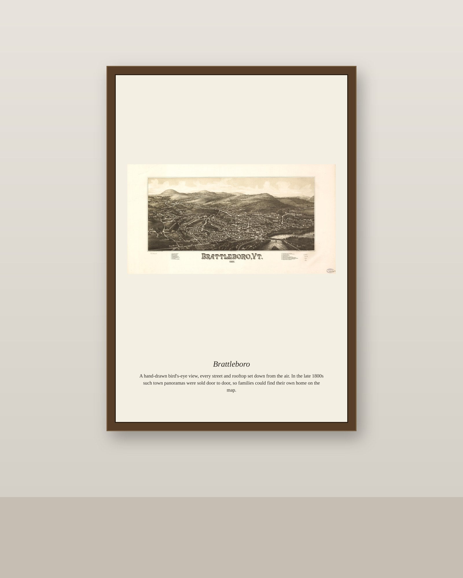 Brattleboro antique map print shown framed on a wall in a styled room