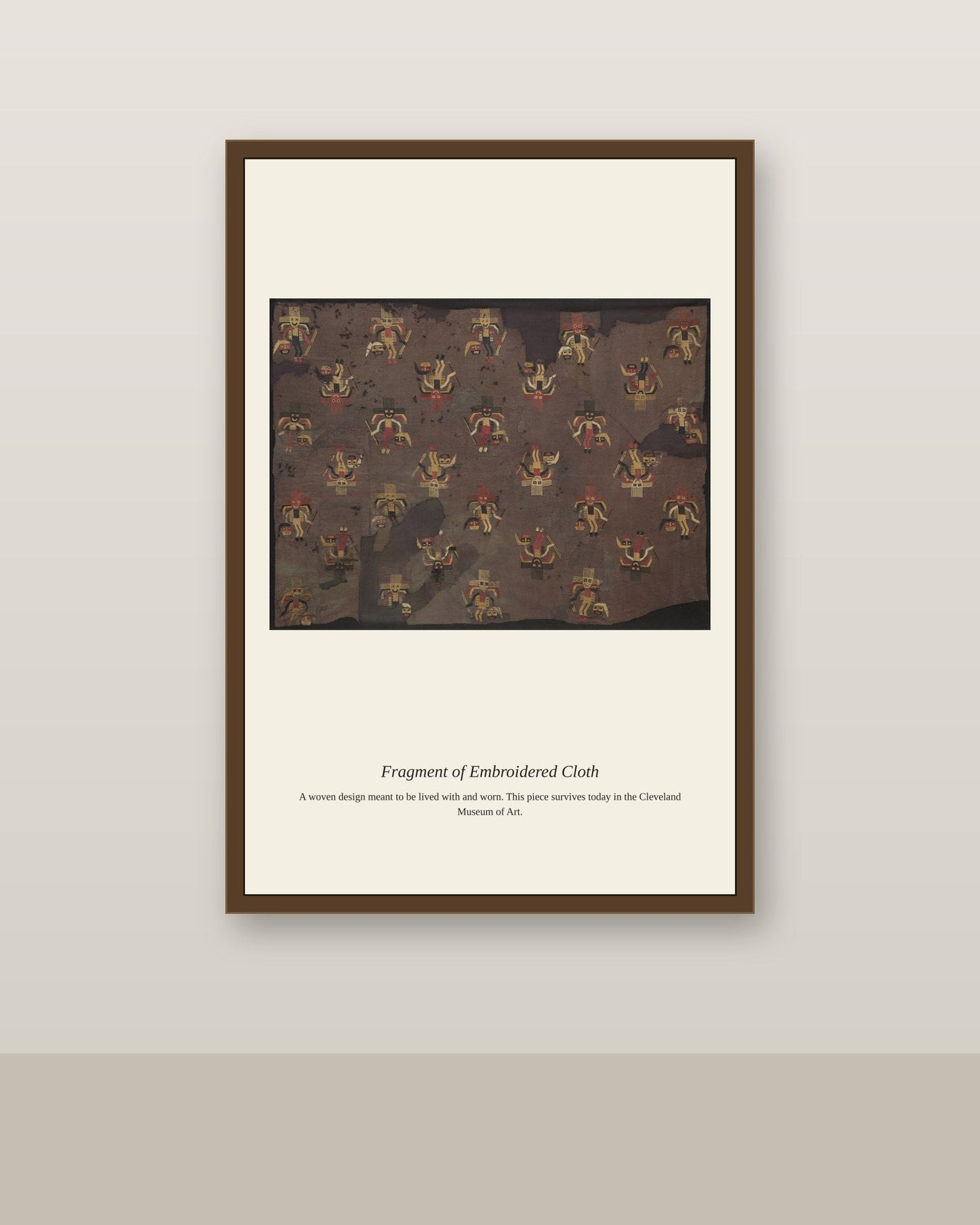 Fragment of Embroidered Cloth antique textile print shown framed on a wall in a styled room