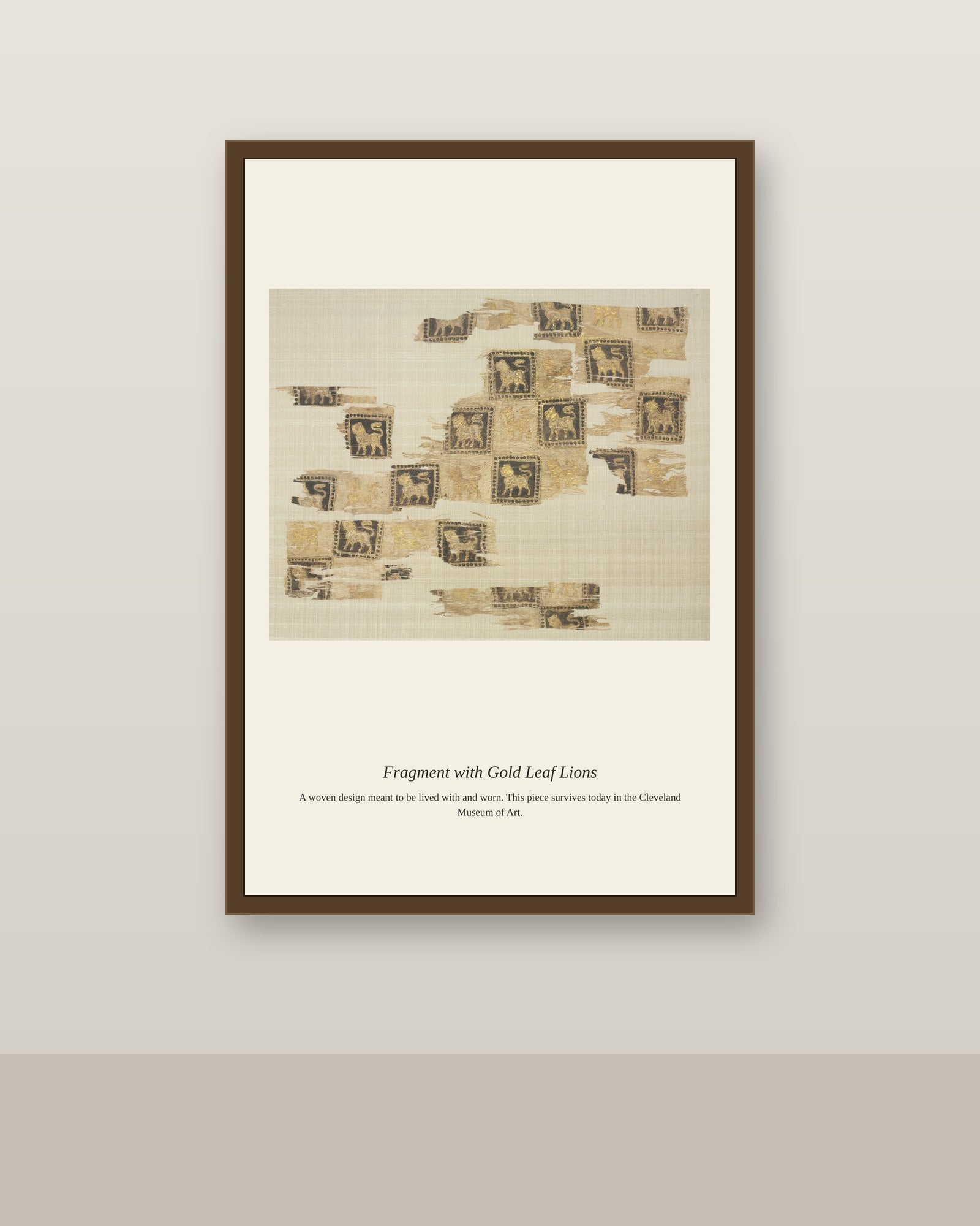 Fragment with Gold Leaf Lions antique textile print shown framed on a wall in a styled room