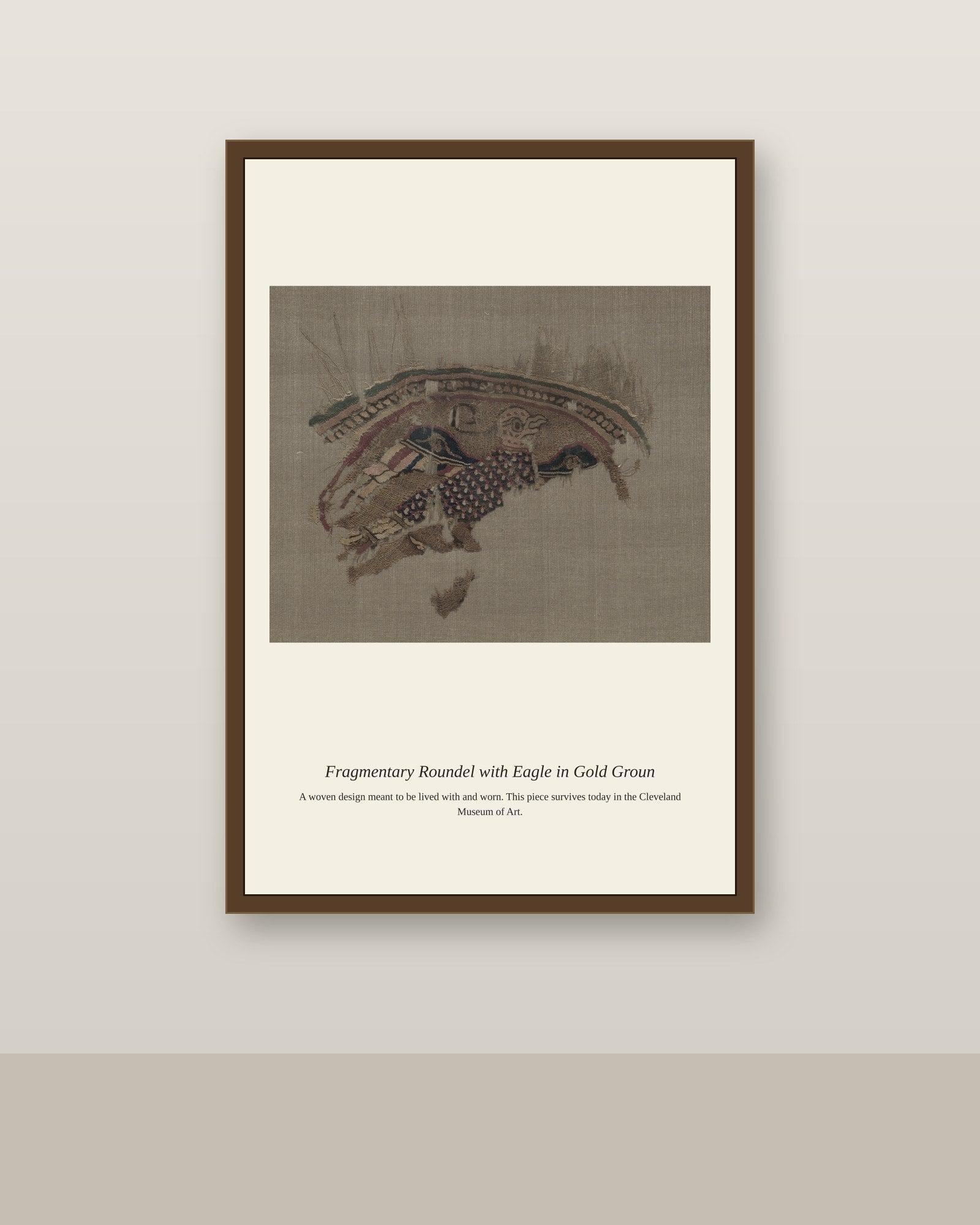 Fragmentary Roundel with Eagle in Gold Groun antique textile print shown framed on a wall in a styled room