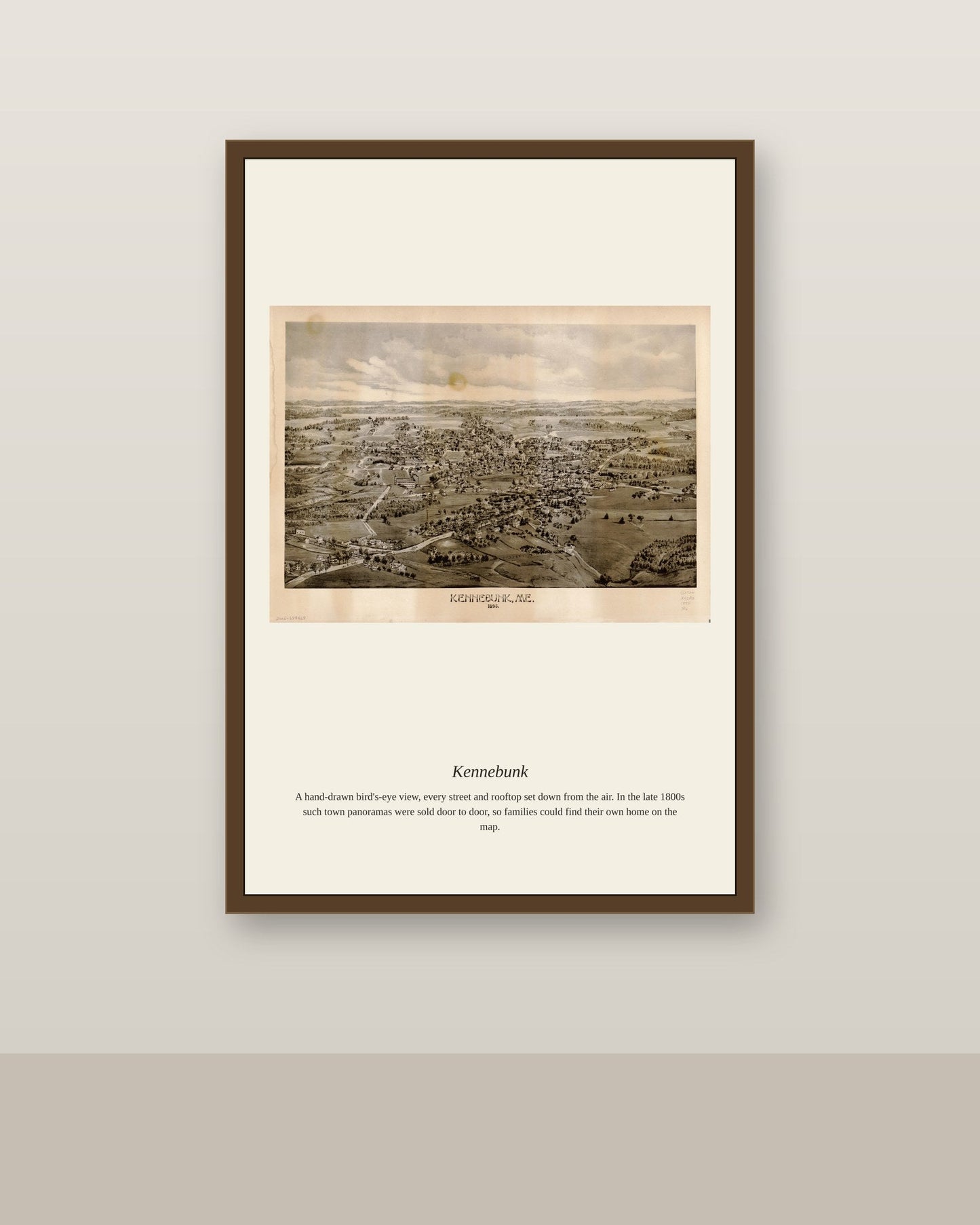 Kennebunk antique map print shown framed on a wall in a styled room