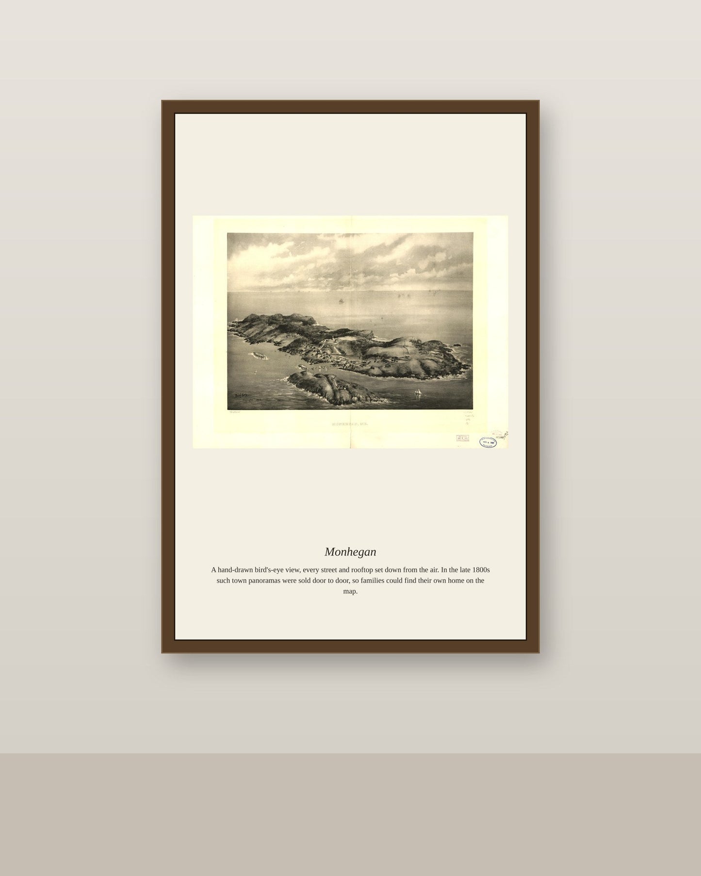 Monhegan antique map print shown framed on a wall in a styled room