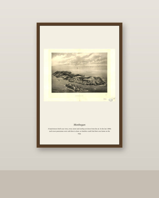 Monhegan antique map print shown framed on a wall in a styled room