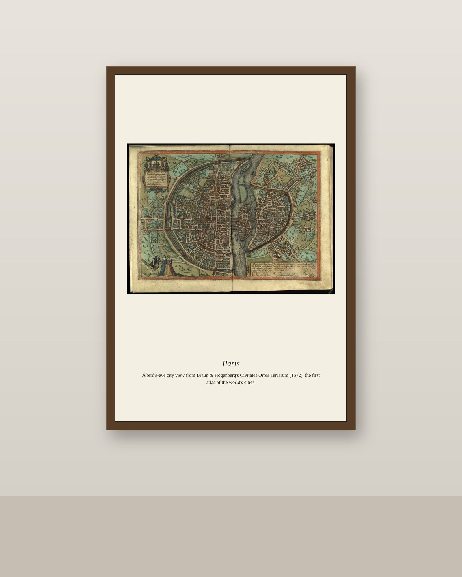 Paris antique city map print shown framed on a wall in a styled room