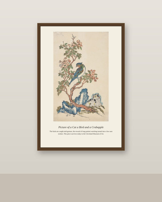 Picture of a Cat a Bird antique natural history print shown framed on a wall in a styled room