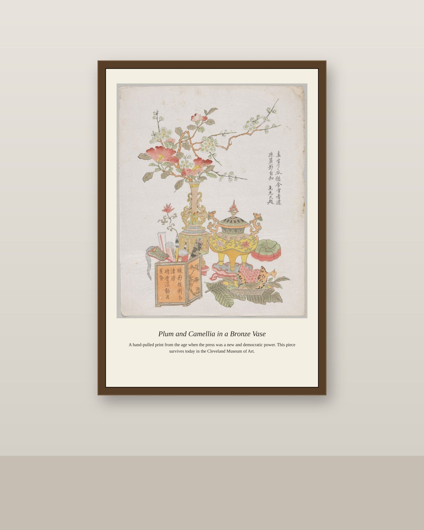 Plum and Camellia in a Bronze Vase antique botanical print shown framed on a wall in a styled room