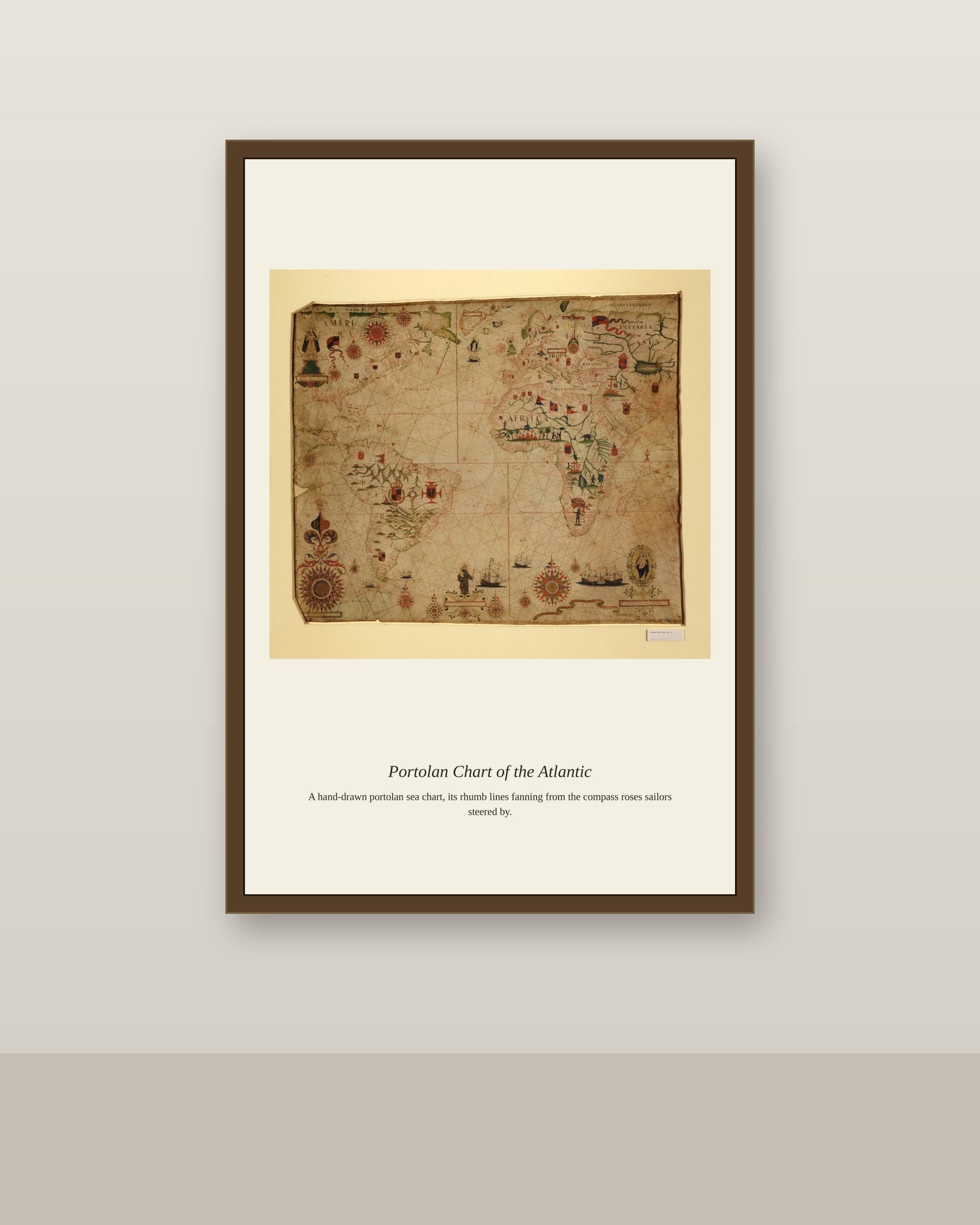 Portolan Chart of the Atlantic Ocean antique nautical chart print shown framed on a wall in a styled room