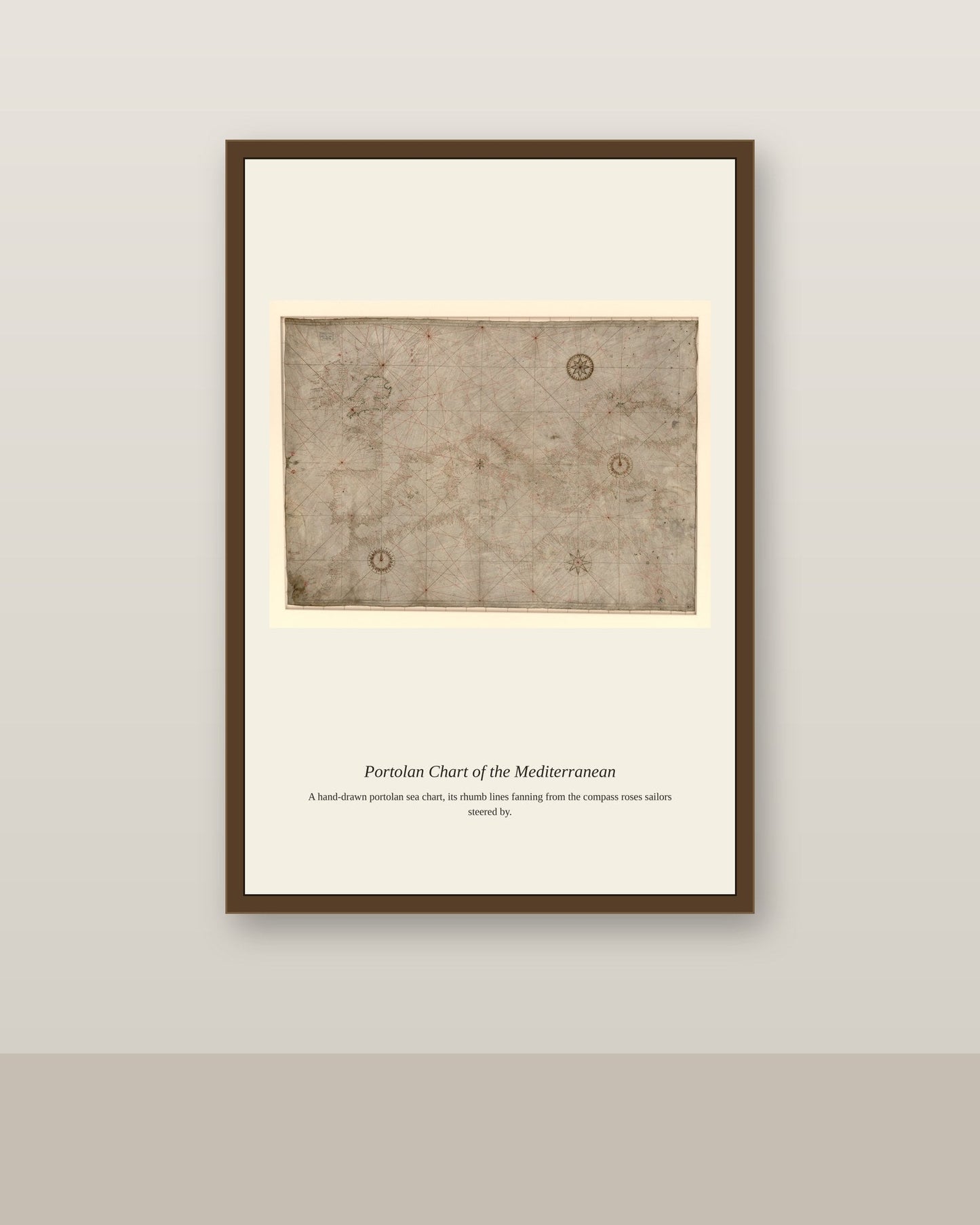 Portolan Chart of the Mediterranean antique nautical chart print shown framed on a wall in a styled room