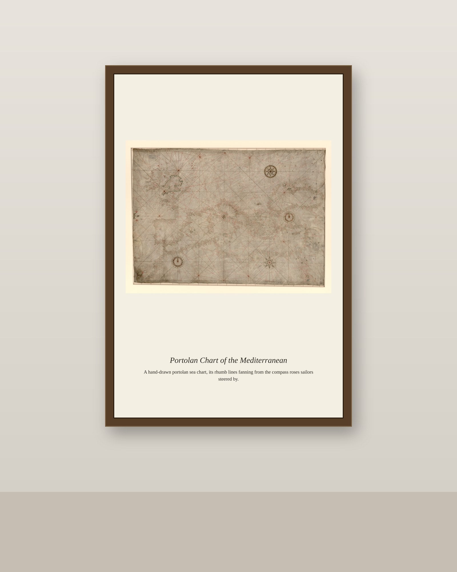 Portolan Chart of the Mediterranean antique nautical chart print shown framed on a wall in a styled room