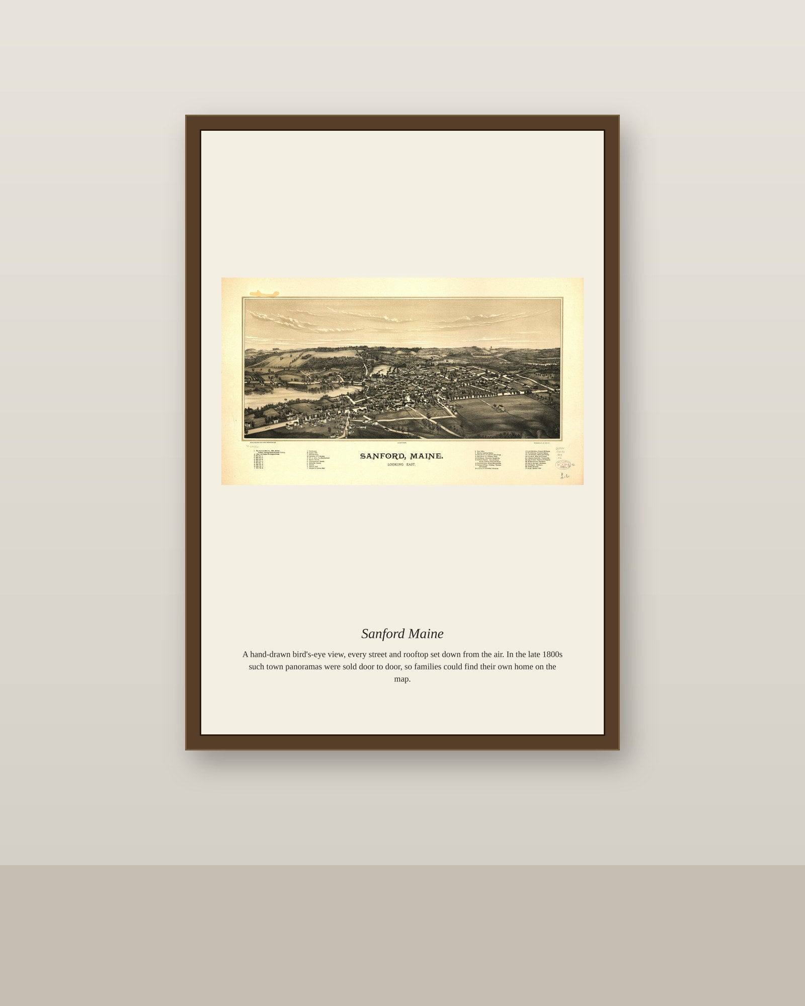 Sanford Maine antique map print shown framed on a wall in a styled room