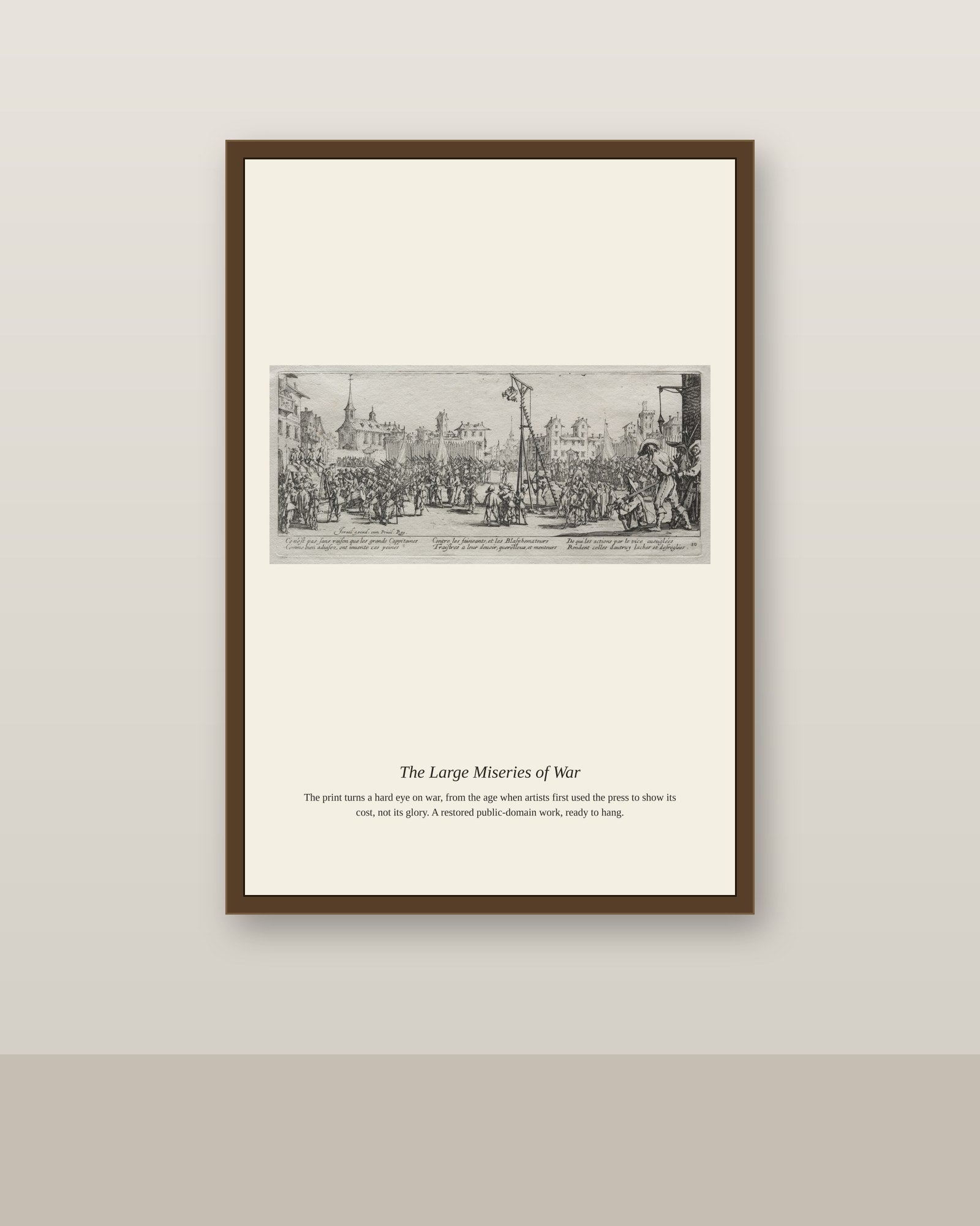 The Large Miseries of War (11) antique historical print shown framed on a wall in a styled room