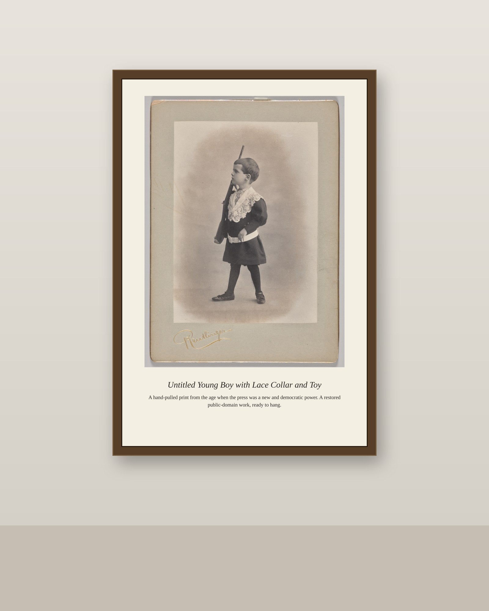 Young Boy with Lace Collar and Toy antique art print shown framed on a wall in a styled room