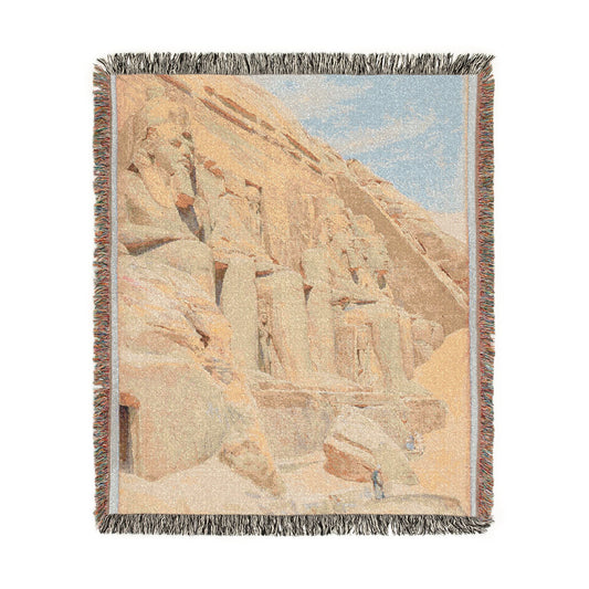 Abu Simbel woven throw blanket flat lay Egyptian temple facade sandstone carved figures sandy beige blue sky