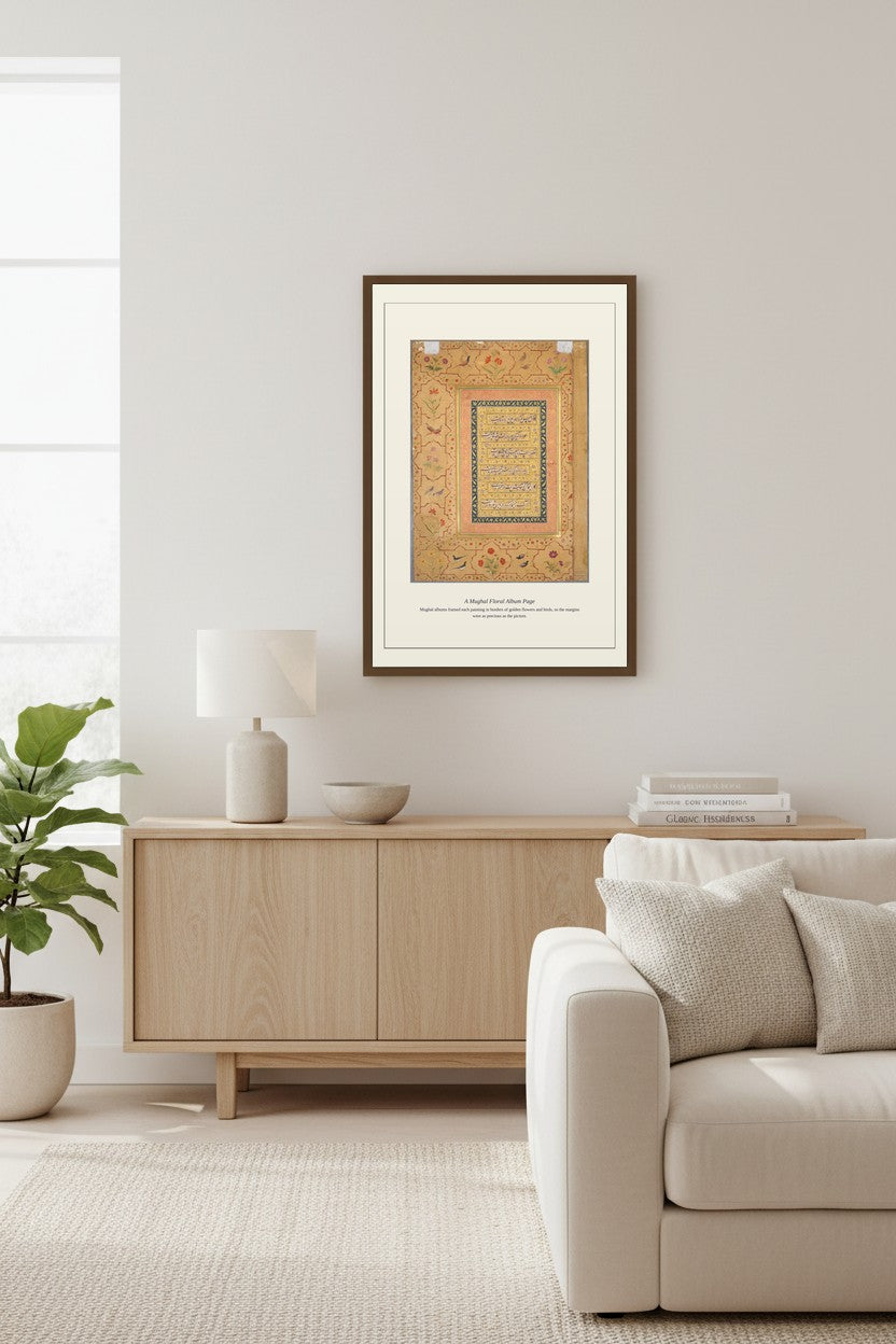 A Mughal Floral Album Page in a dark frame on a wall beside a tall window in a neutral living room