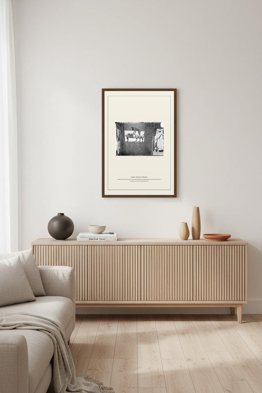 Anubis Tends the Mummy print above a light fluted wood sideboard in a living room