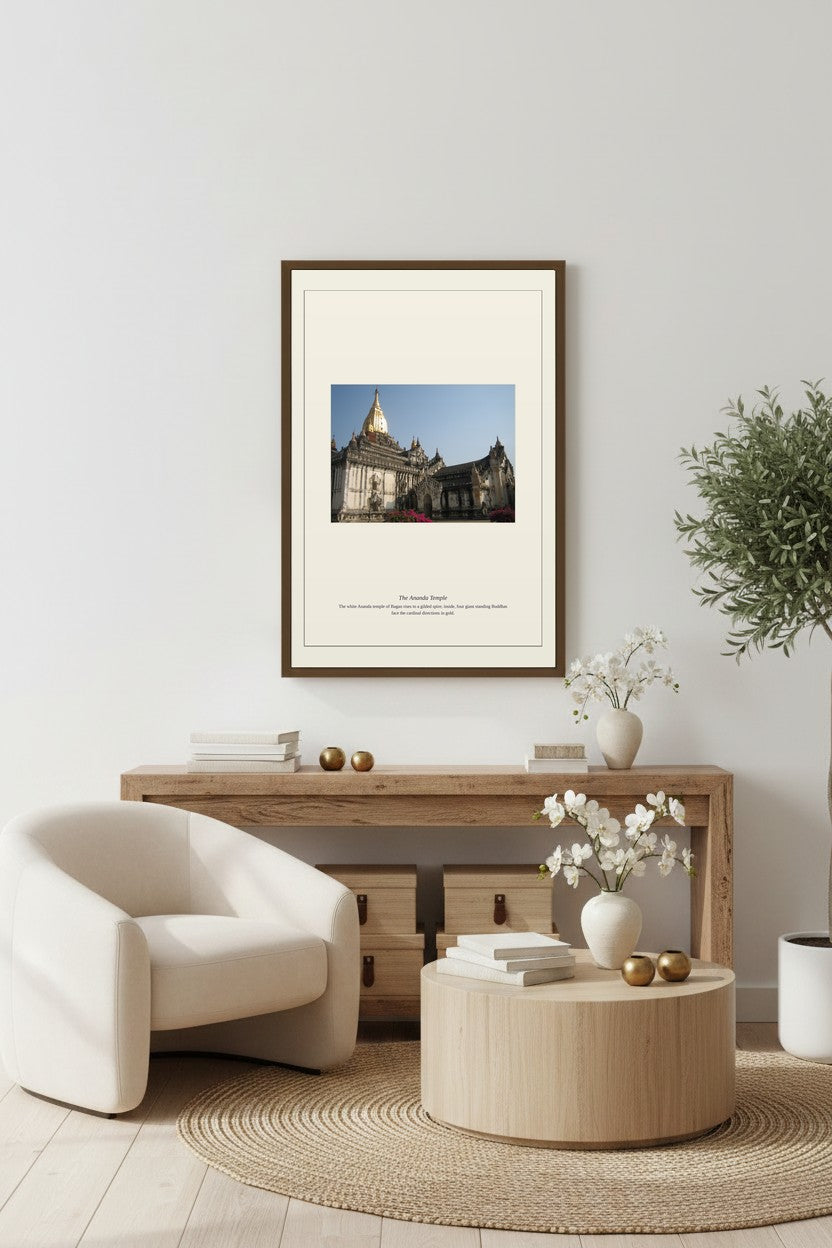 The Ananda Temple framed print above a wooden console beside a white armchair