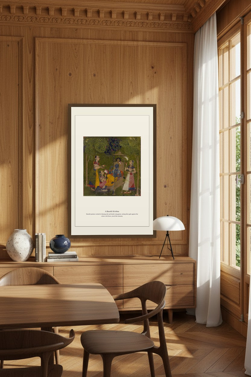 A Basohli Krishna framed in a wood-paneled dining room with a table lamp