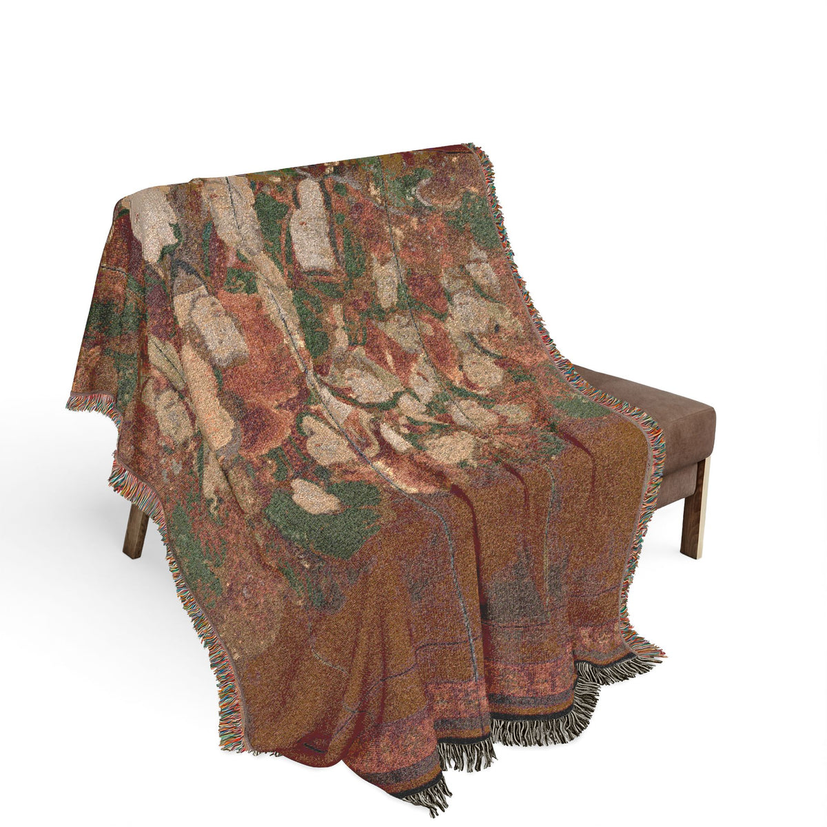 Buddhist Deities woven throw blanket on wooden bench, crimson and moss green figures in layered textile drape