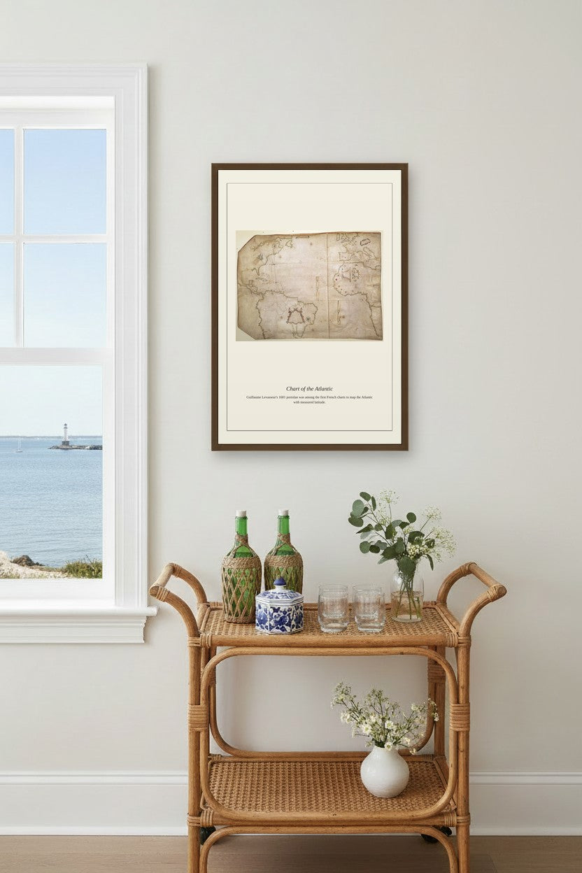 Chart of the Atlantic Ocean nautical print framed above a beige sectional sofa in a bright living room