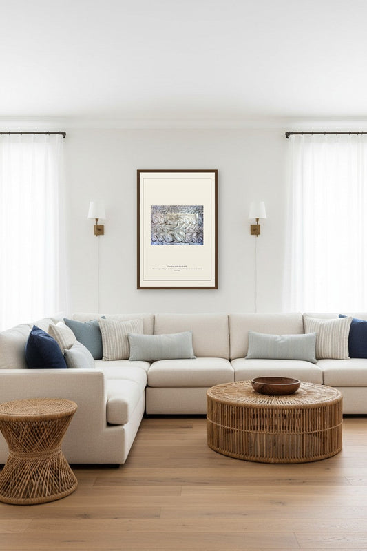 Churning of the Sea of Milk framed print hanging in a coastal living room with sheer curtains and a wicker side table