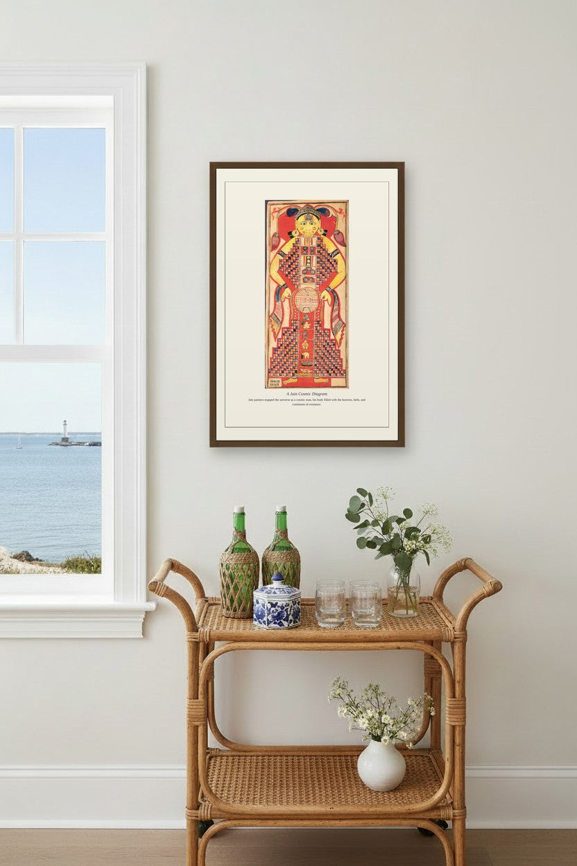 A Jain Cosmic Diagram framed print on a coastal wall above a rattan bar cart