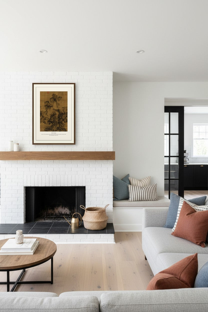 Song dynasty landscape print framed above a white fireplace mantel