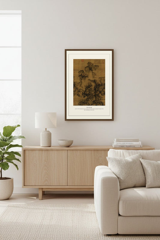 Early Spring ink painting print framed above a light wood sideboard