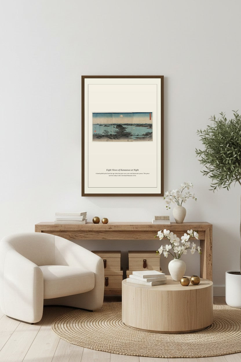 Eight Views of Kanazawa at Night print framed above a console table beside a potted plant