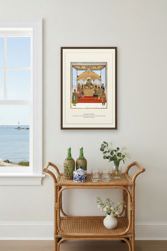 The Emperor's Darbar art print framed above a coastal bar cart with green bottles