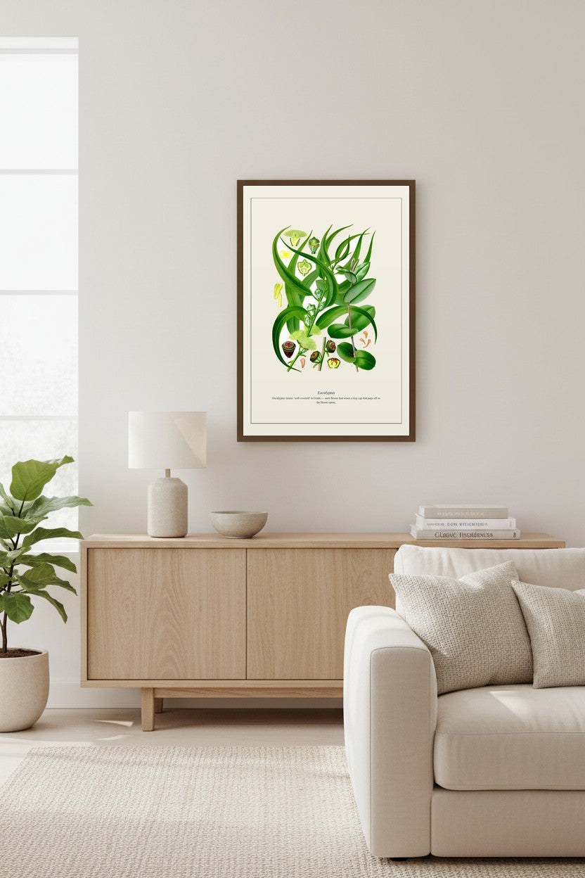 Eucalyptus print framed and displayed above a wood sideboard beside a fiddle leaf fig